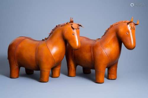 A PAIR OF LEATHER PONY OTTOMANS IN THE MANNER OF DIMITRI OME...