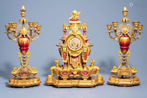 A FRENCH GILT BRONZE SÈVRES STYLE PORCELAIN THREE-PIECE CLOC...