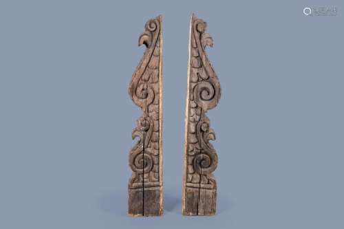A PAIR OF LARGE CARVED OAK CORBELS WITH FLORAL DESIGN, FLAND...