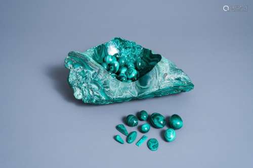 A LARGE PARTLY POLISHED MALACHITE BOWL WITH AN EXTENSIVE COL...