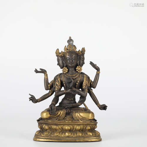 Chinese gilt bronze eight-armed Buddha, 18th century