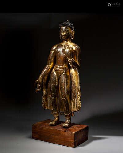 A GILT-BRONZE FIGURE OF SAKYAMUNI