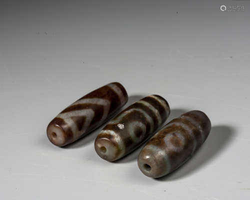 A SET OF THREE DIZ BEADS