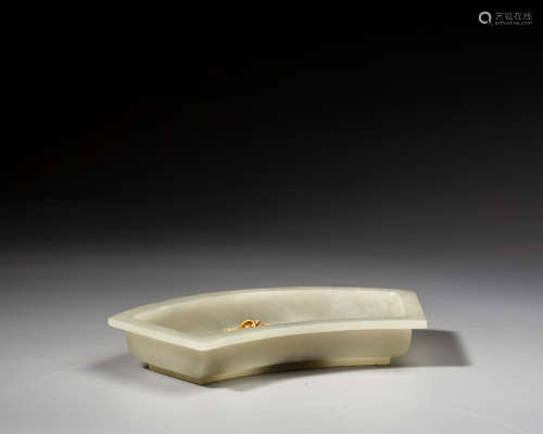A GOLD-INLAID WHITE JADE WASHER