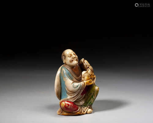 A CHINESE SOAPSTONE FIGURE OF LUOHAN