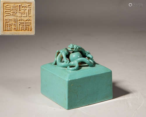 A CHINESE CELADON-GLAZED 'DRAGON' SEAL,MARK AND PERIOD OF QI...