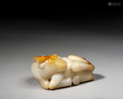 A CHINESE JADE FIGURE OF A RECUMBENT BUFFALO