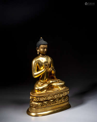 A GILT-BRONZE FIGURE OF BUDDHA