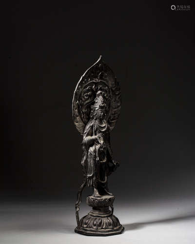 A BRONZE FIGURE OF GUANYIN