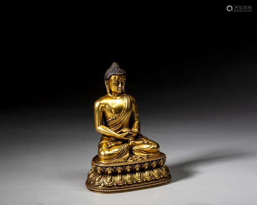 A GILT-BRONZE FIGURE OF BUDDHA