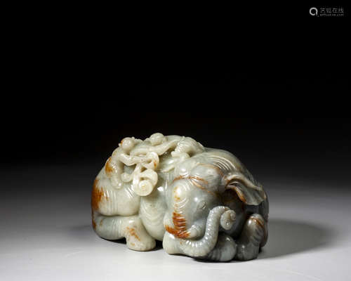 A CARVED JADE FIGURE OF BOYS AND ELEPHANT