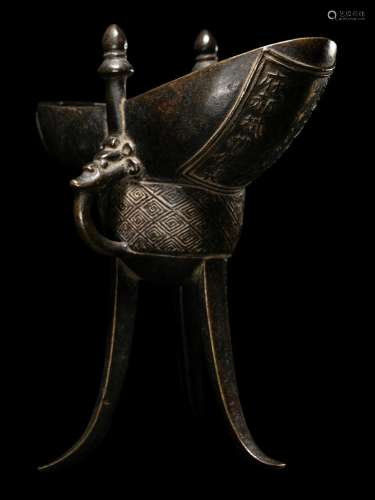A Chinese Bronze Wine Vessel, Jue Height 5 5/8 in., 14.3 cm.