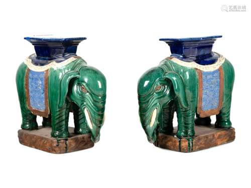 A Pair of Chinese Polychrome Glazed Porcelain Elephant Stand...