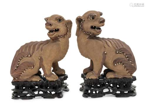 A Pair of Chinese Yixing Zisha Pottery Figures of Fu Lions H...