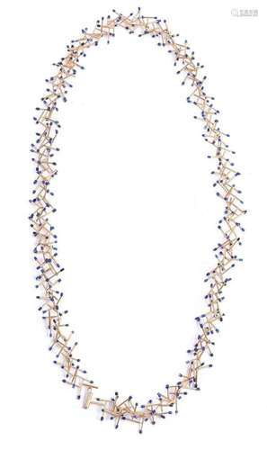 JACQUELINE RYAN, STICKLETS, A LAPIS LAZULI AND GOLD COLOURED...