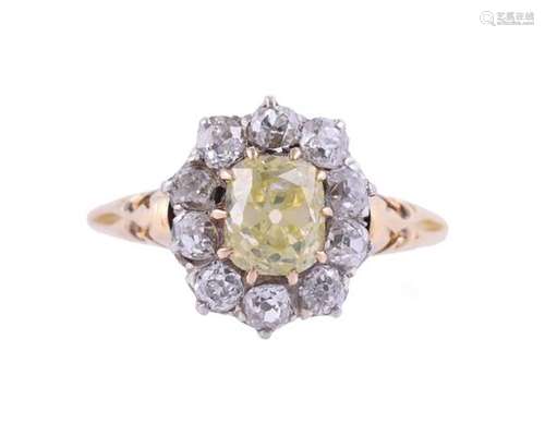 A DIAMOND AND YELLOW DIAMOND CLUSTER RING