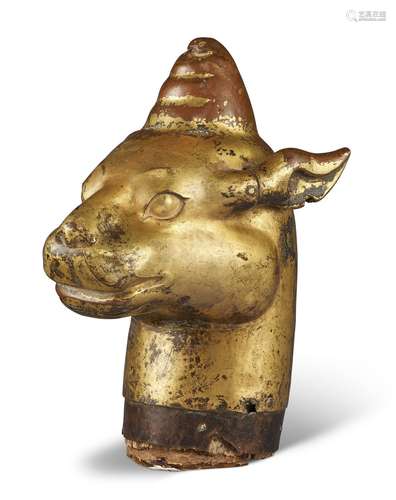 A LARGE GILT-BRONZE HEAD OF A MYTHICAL BEAST