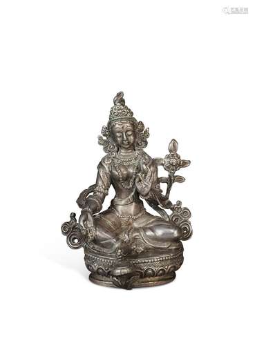 A SMALL SILVER FIGURE OF TARA