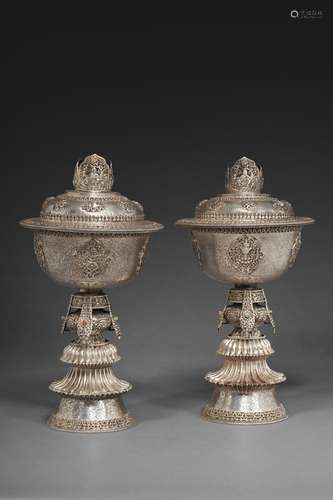 A PAIR OF FINELY-INCISED SILVER BUTTERLAMPS AND COVERS WITH ...