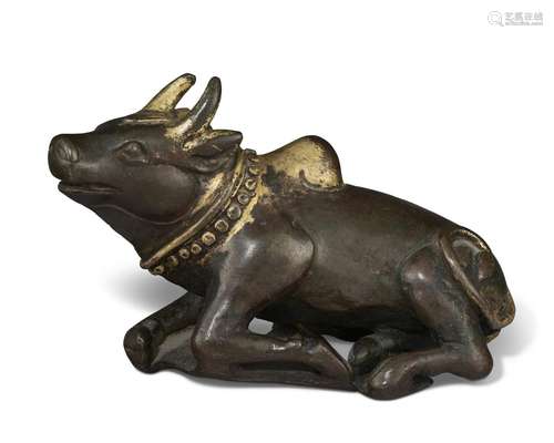 A GILT-COPPER FIGURE OF NANDI