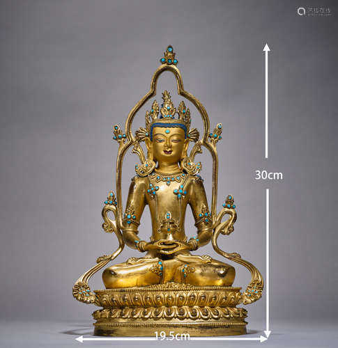 Gilded Buddha statues are inlaid with turquoise    鎏金佛像镶...