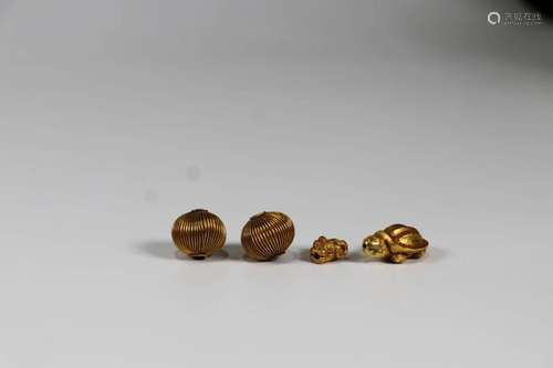 Four Gold Made Beads