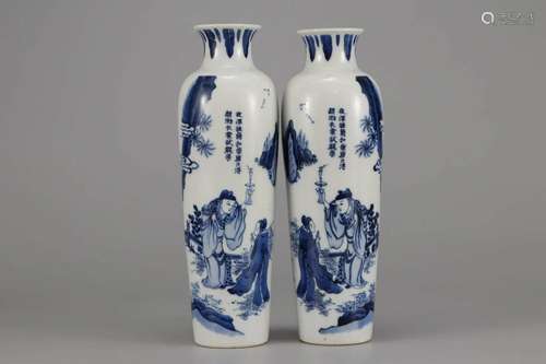 PAIR OF BLUE AND WHITE FIGURE ROULEAU VASES