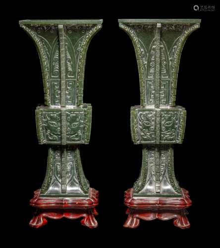A Pair of Spinach Jade 'Taotie' Gu Vases Height 11...