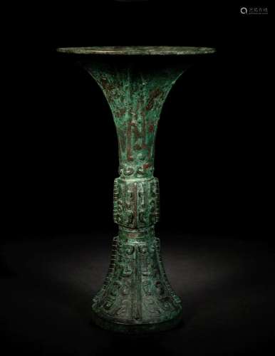 An Archaic Bronze Wine Vessel, Gu Height 11 in., 28 cm.