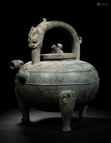 An Archaic Bronze Tripod Wine Vessel, He Height 11 x width 1...