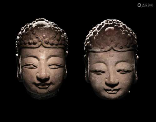 A Pair of Carved Stone Heads of Buddha Height of larger 21 1...