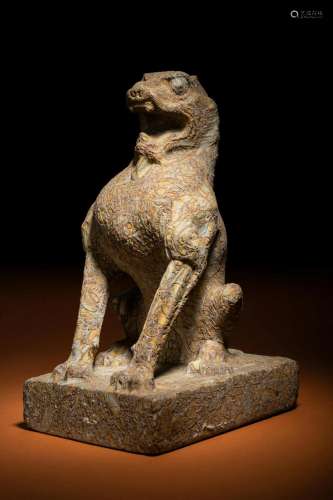 A Carved Puddingstone Figure of a Seated Lion Height 11 1/2 ...