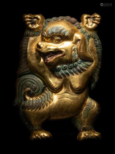 A Sino-Tibetan Gilt Bronze Repoussé Fu-Lion Height 8 in., 20...