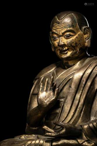 A Large Tibetan Parcel Gilt Bronze Repoussé Figure of a Seat...