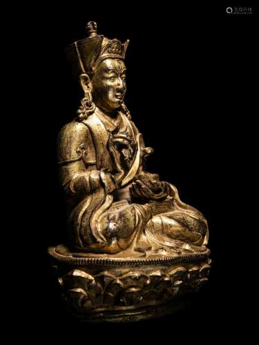 A Tibetan Gilt Bronze Figure of a Seated Karmapa Height 6 1/...