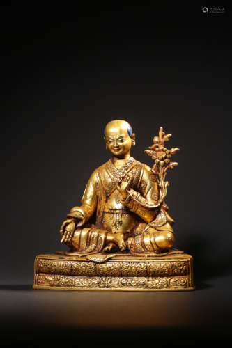 A GILT-BRONZE FIGURE OF GURU,QING DYNASTY