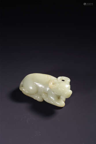 A CARVED WHITE JADE RECUMBENT BUFFALO,QING DYNASTY