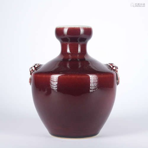 A red glazed vase