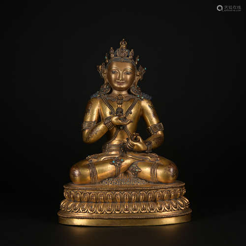 A gilt-bronze statue of Master Kong