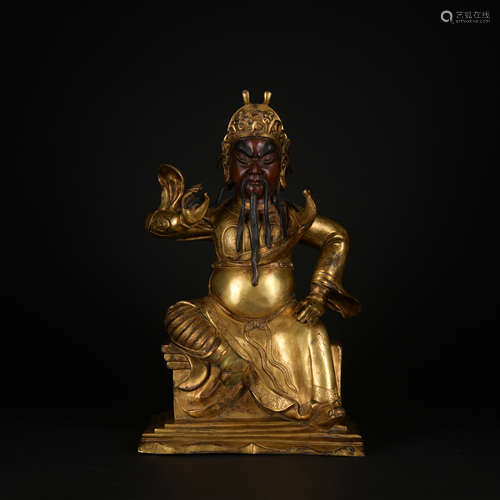 A gilt-bronze statue of Guan Yu