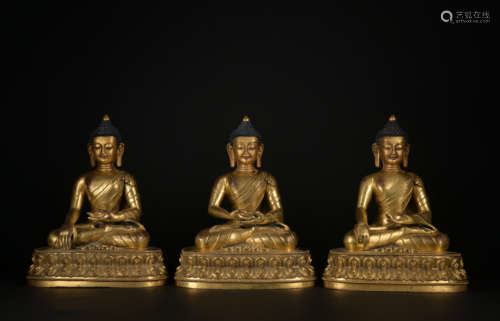 A gilt-bronze statue of Trikalea Buddhas