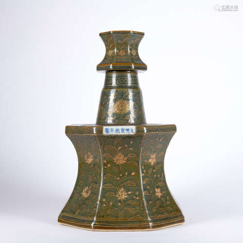 A celadon-glazed candle stick painting in gold