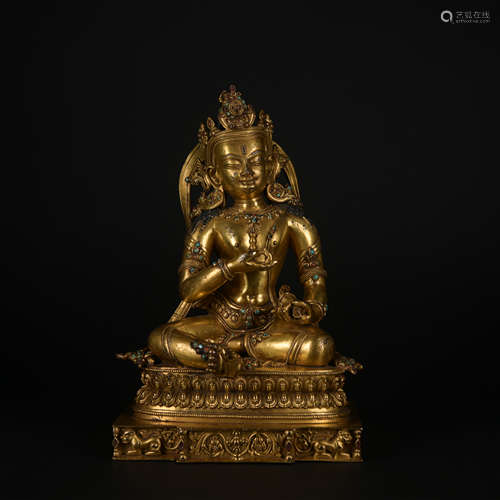 A gilt-bronze statue of Vajrapani