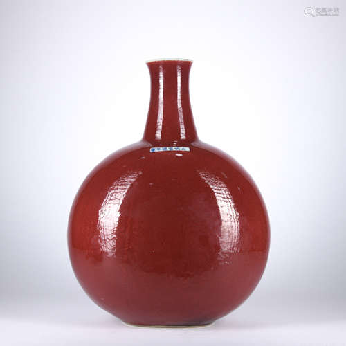 A red glazed vase