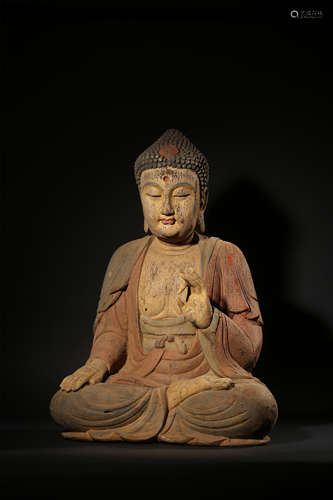 A POLYCHROME WOOD FIGURE OF SAKYAMUNI