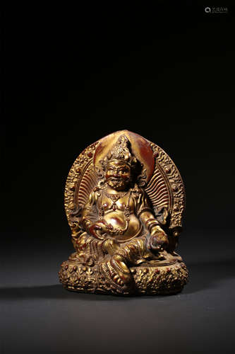 A  GILT-BRONZE FIGURE OF JAMBHALA,QING DYNASTY