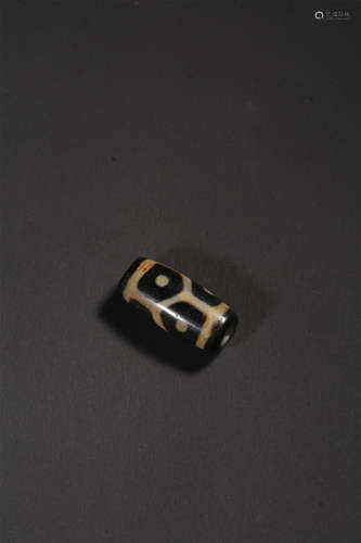 A SIX-EYED DZI BEAD