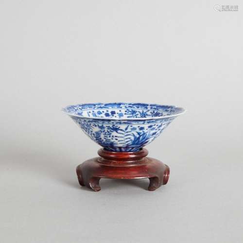 A Chinese Blue and White Barbed-Rim Saucer and Wood Stand (D...