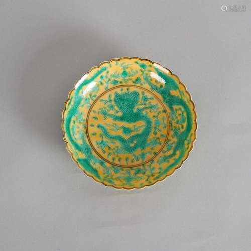 A Chinese Qing Dynasty Yellow-Ground Green-Enamel Barbed-Rim...