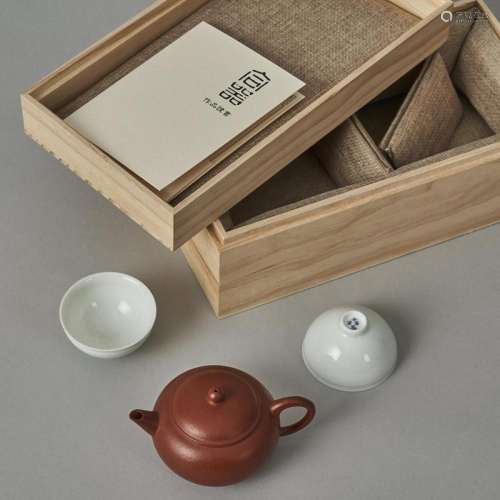 A Chinese Red Clay Teapot (Yong Liming Zhi Mark) and Two Whi...